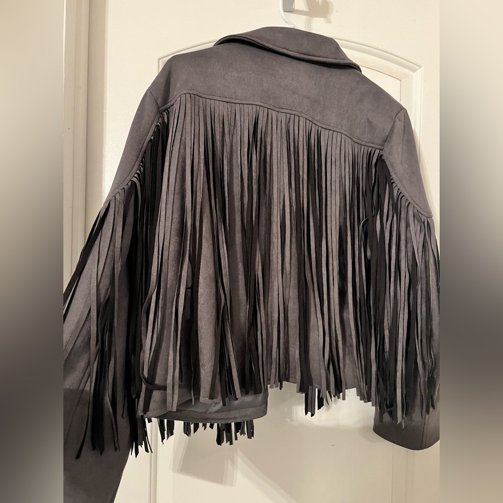Size XL faux leather fringe jacket.